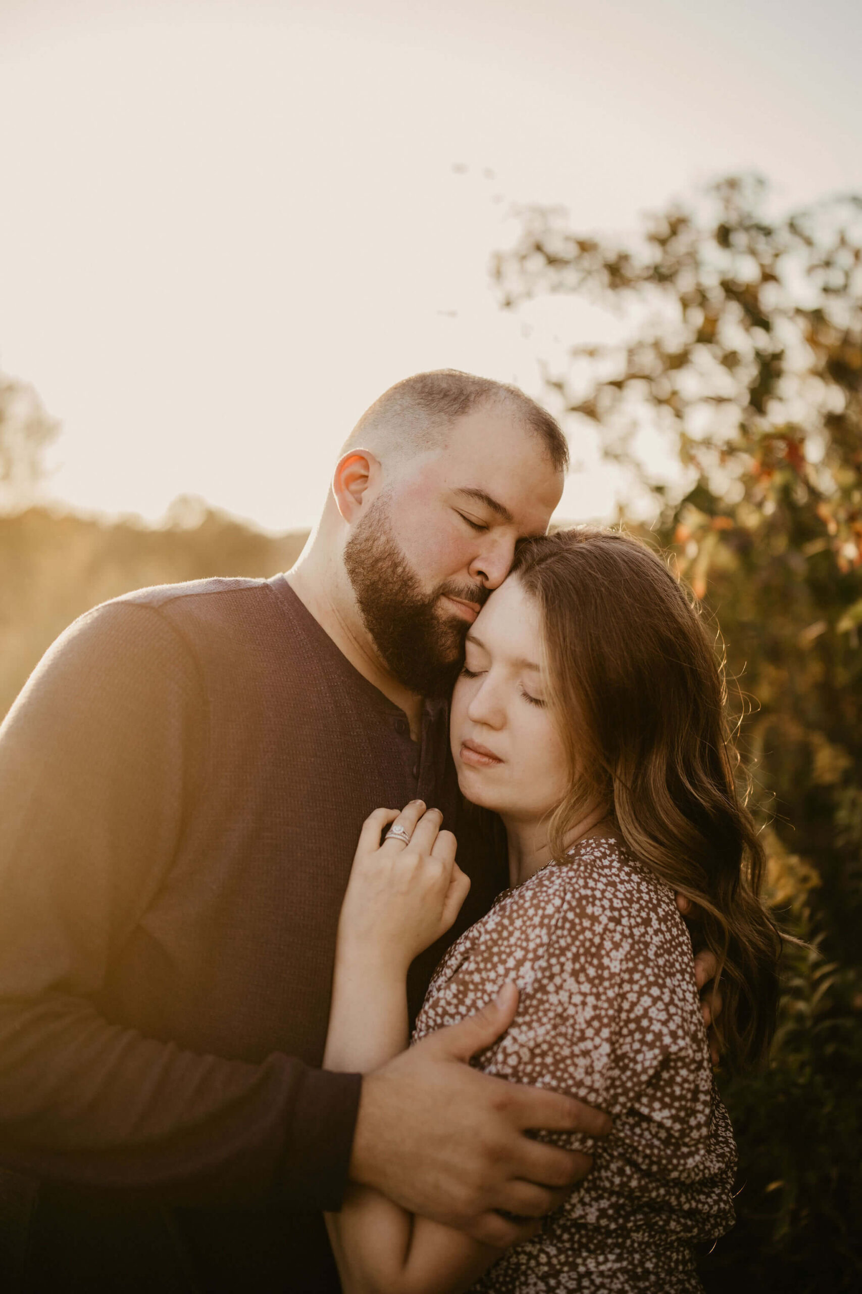 close up image of a husband and wife embracing, with their eyes closed