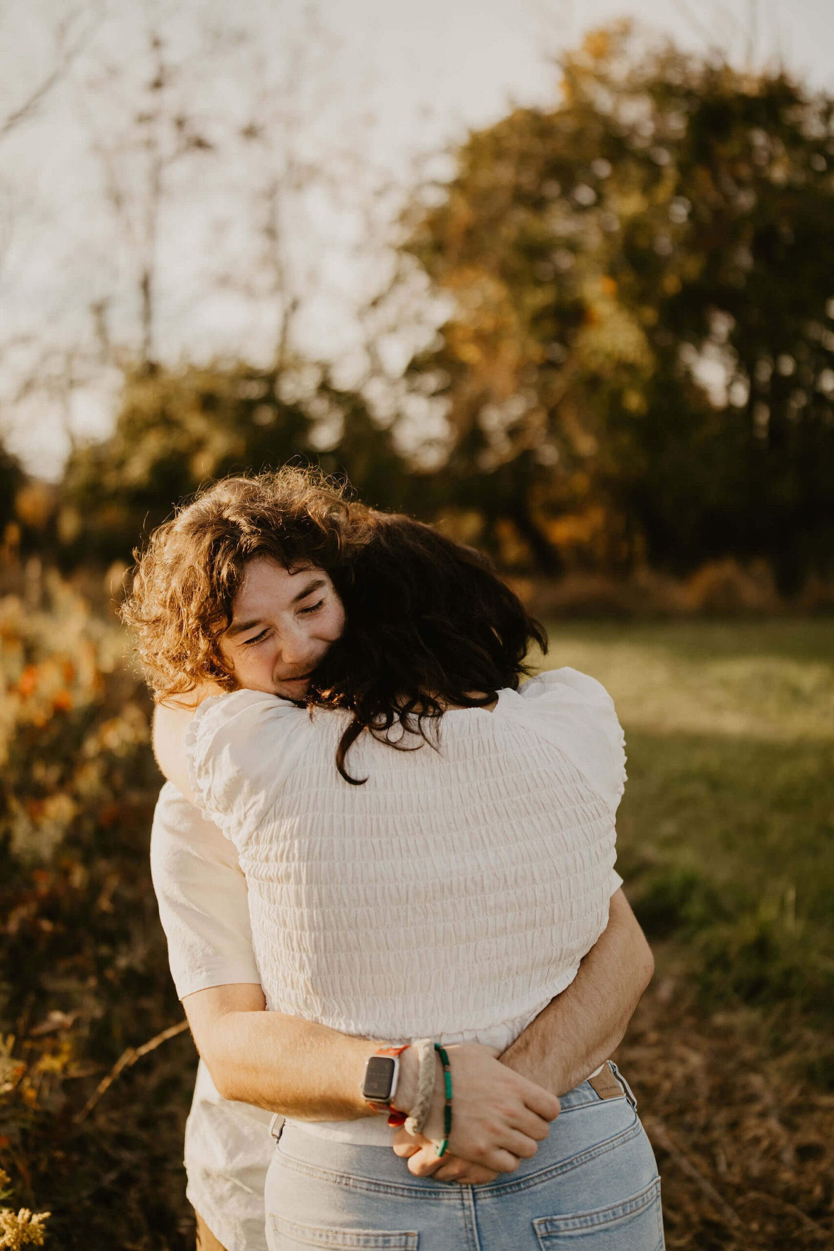 a boy and a girl hugging tightly