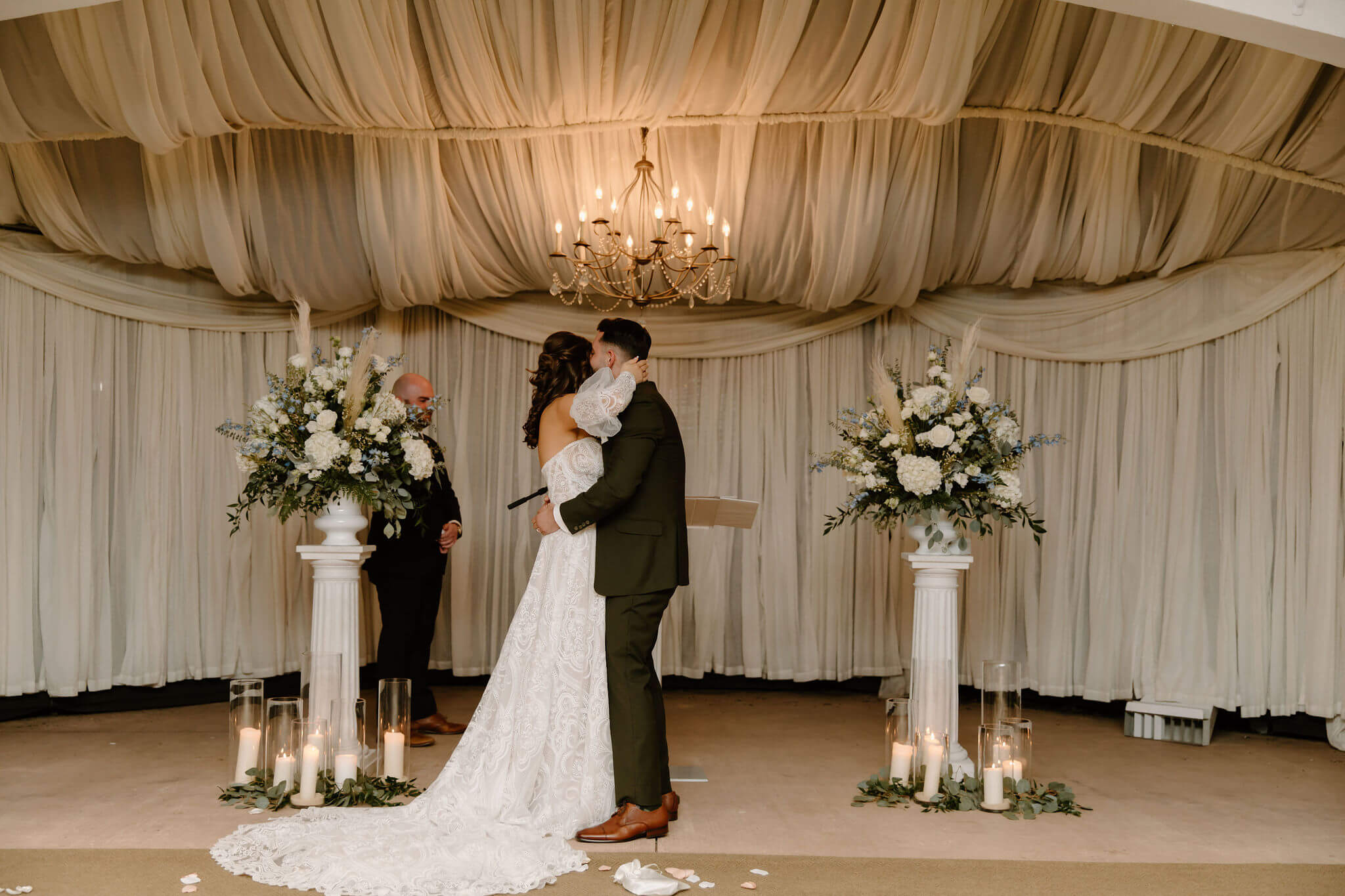 bride and groom embracing after their wedding ceremony