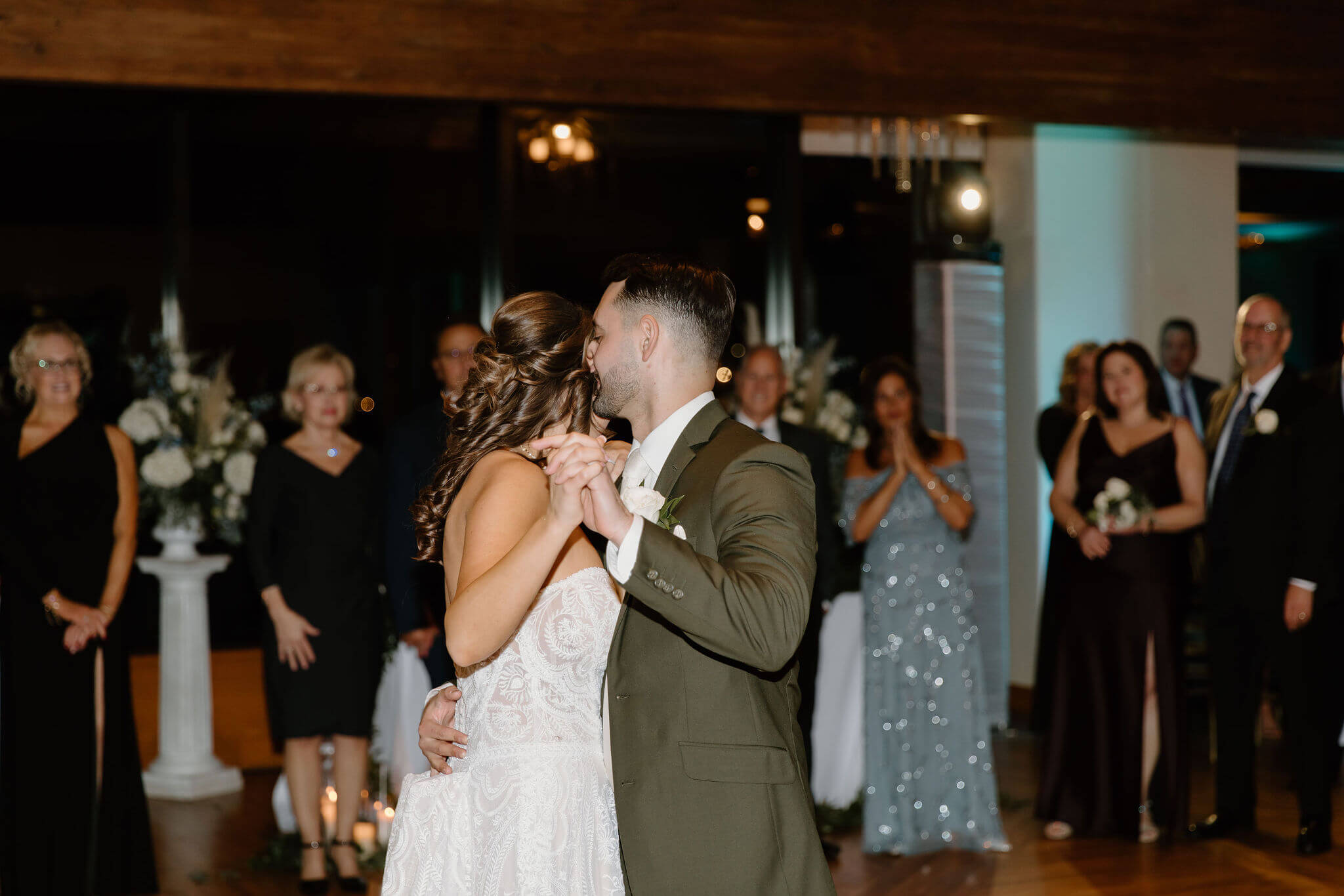 bride and groom embracing during their first dance