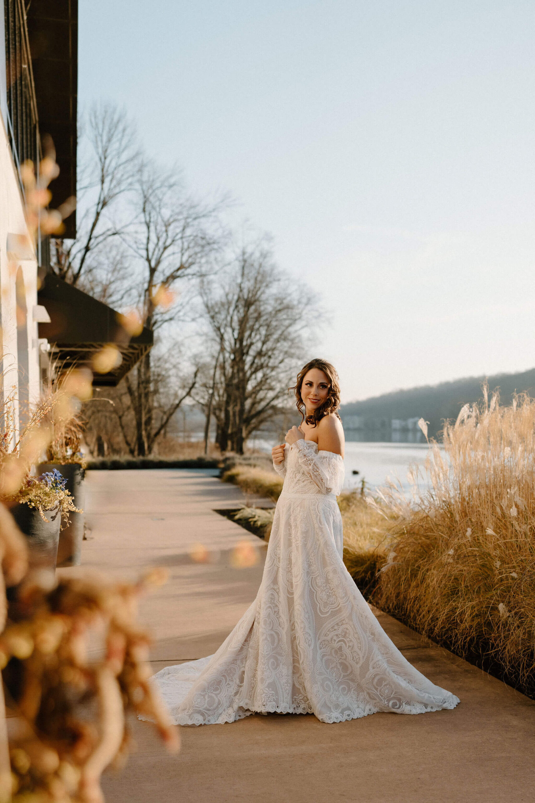 bride (brown hair, textured off-white dress) seeing her groom for the first time