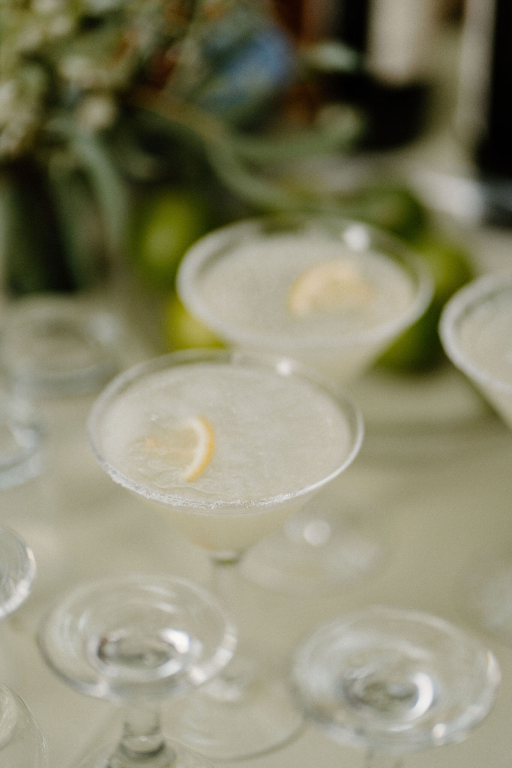 close up image of two lemon drop martinis at the bar