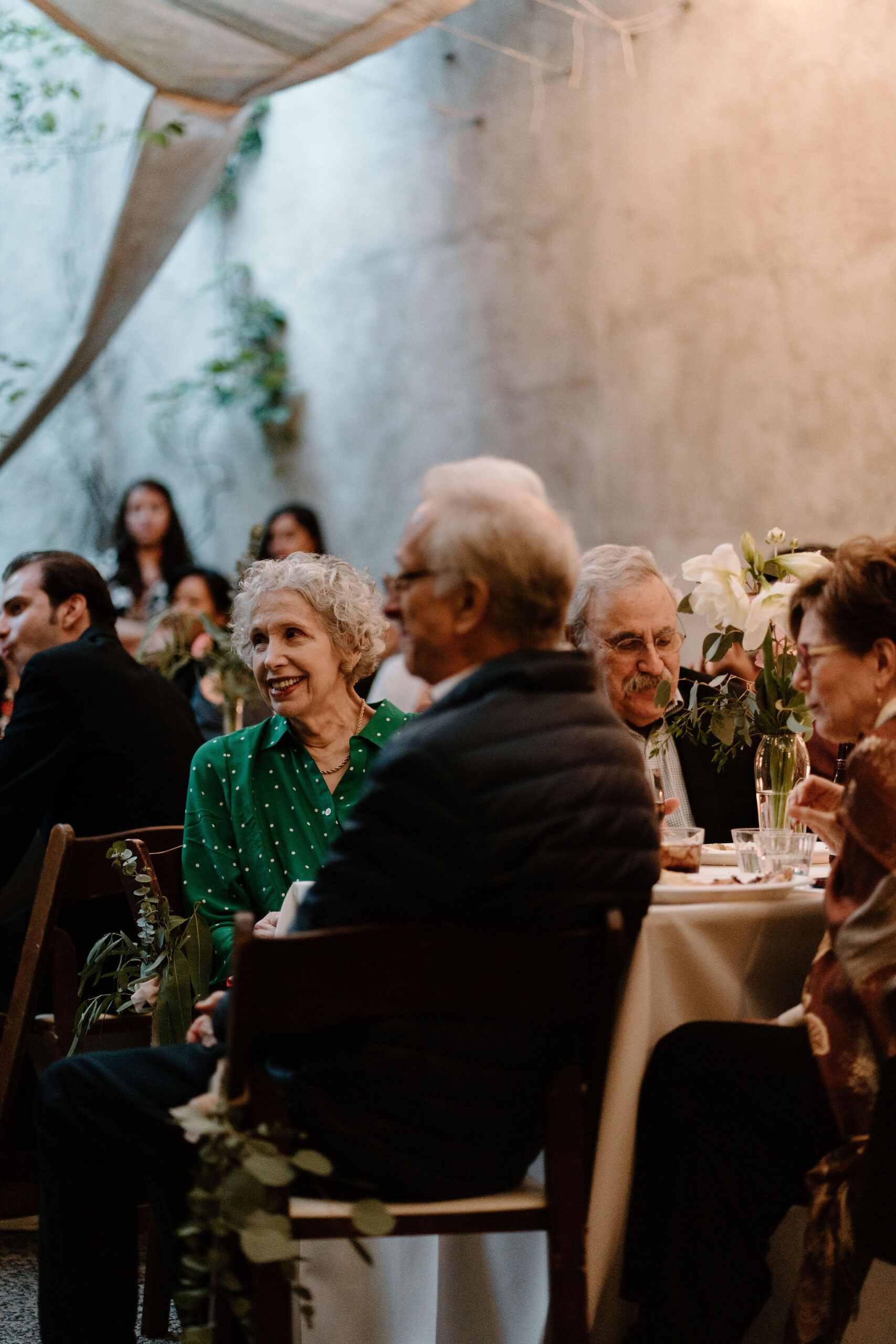 guests smiling during speeches