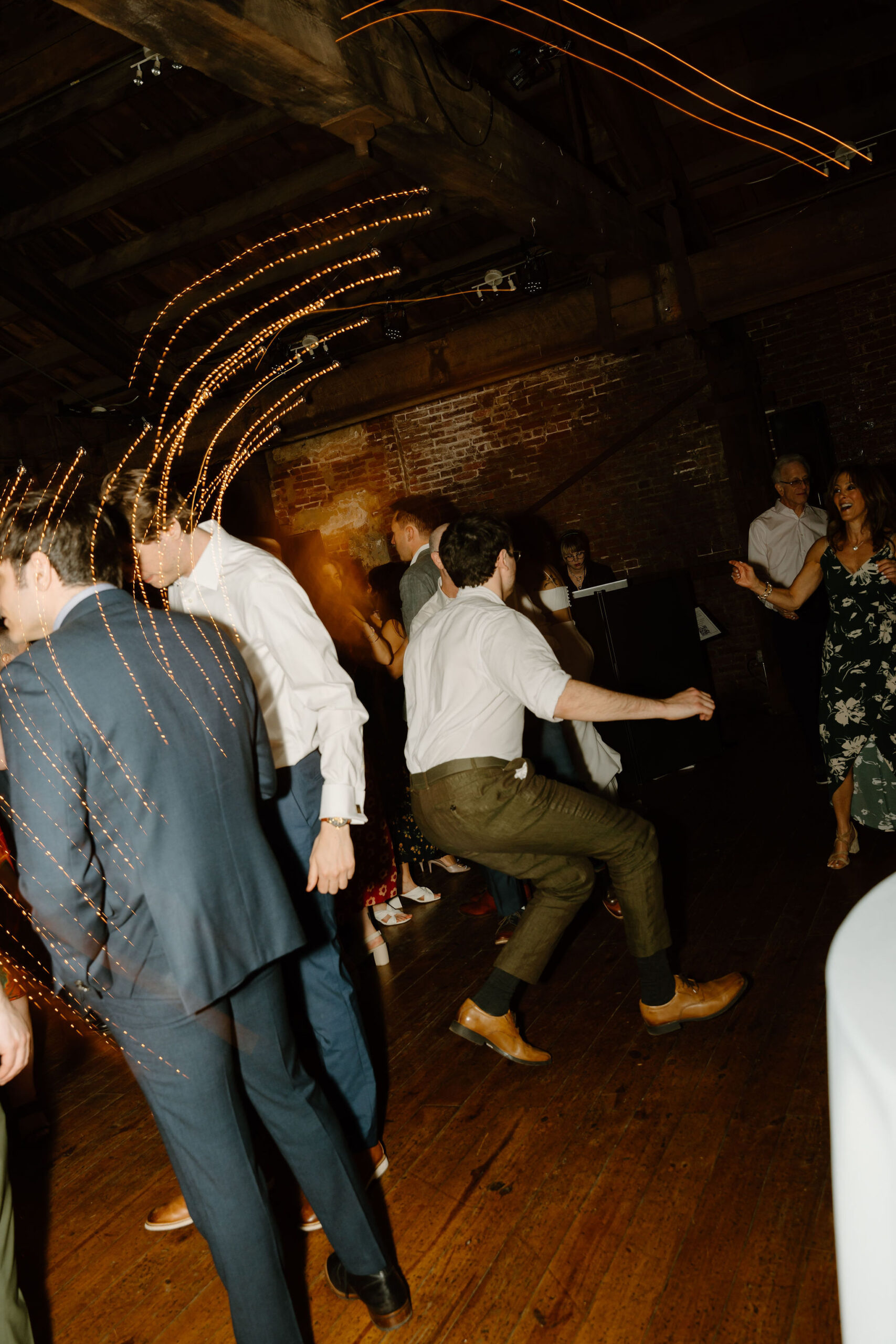 the groom dancing during the wedding reception