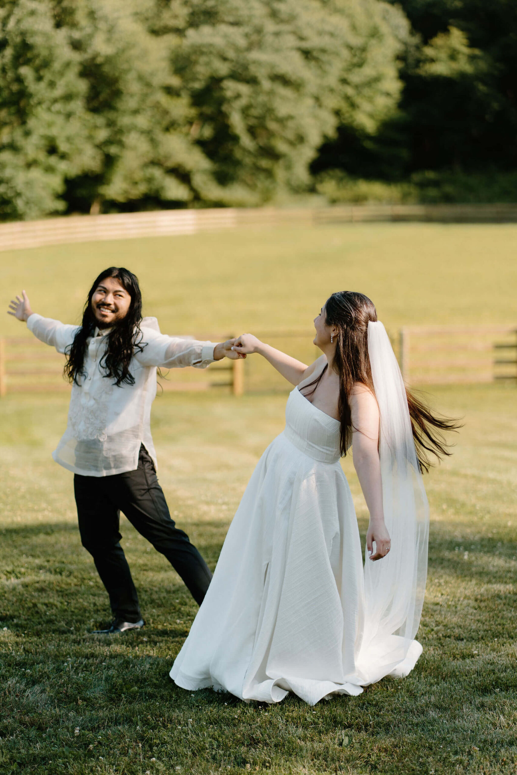 bride and groom celebrating the end of their wedding ceremony, holding hands and dancing