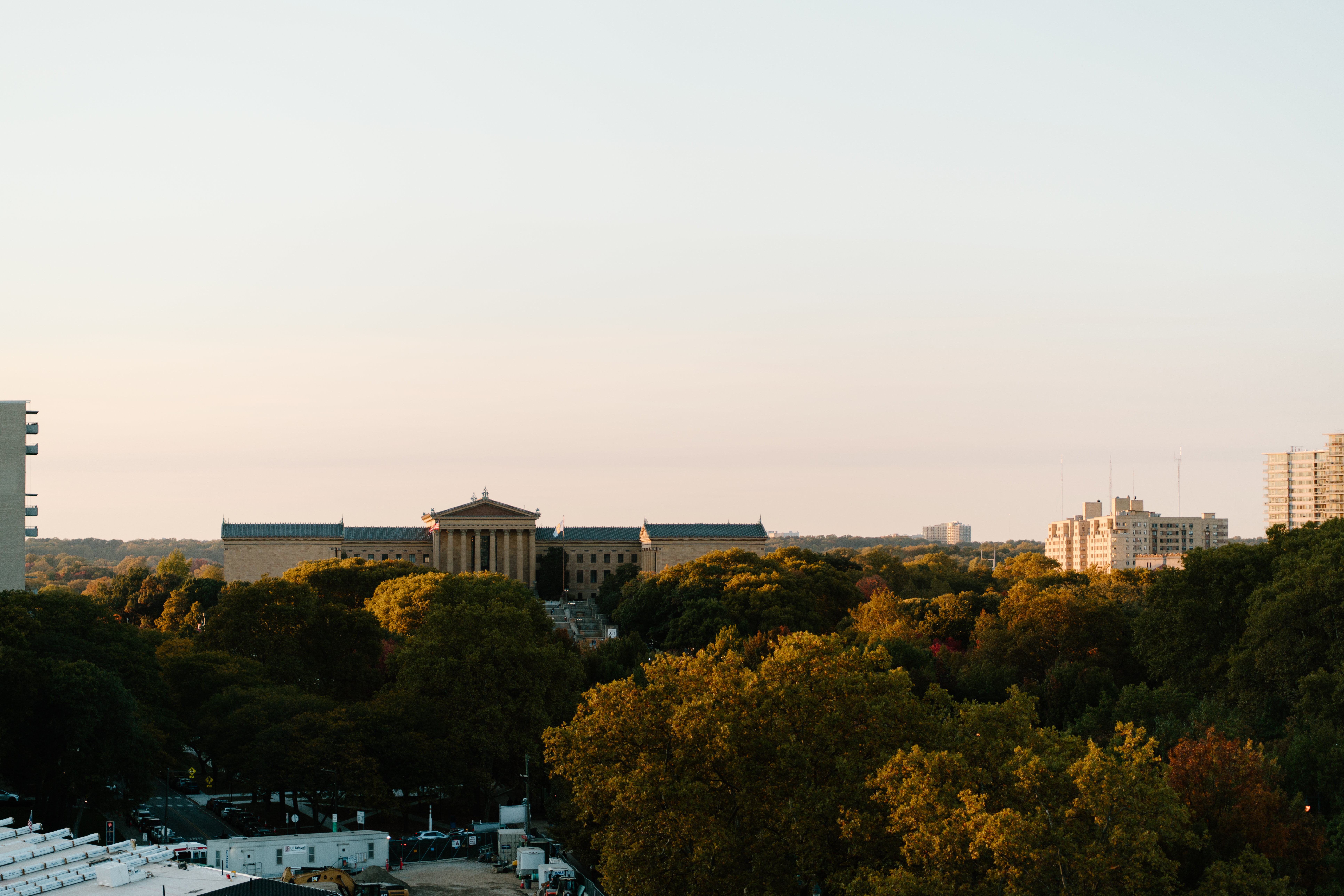 A far-away photo of the Philadelphia Museum of Art, looking up from below the Benjamin Franklin Parkway