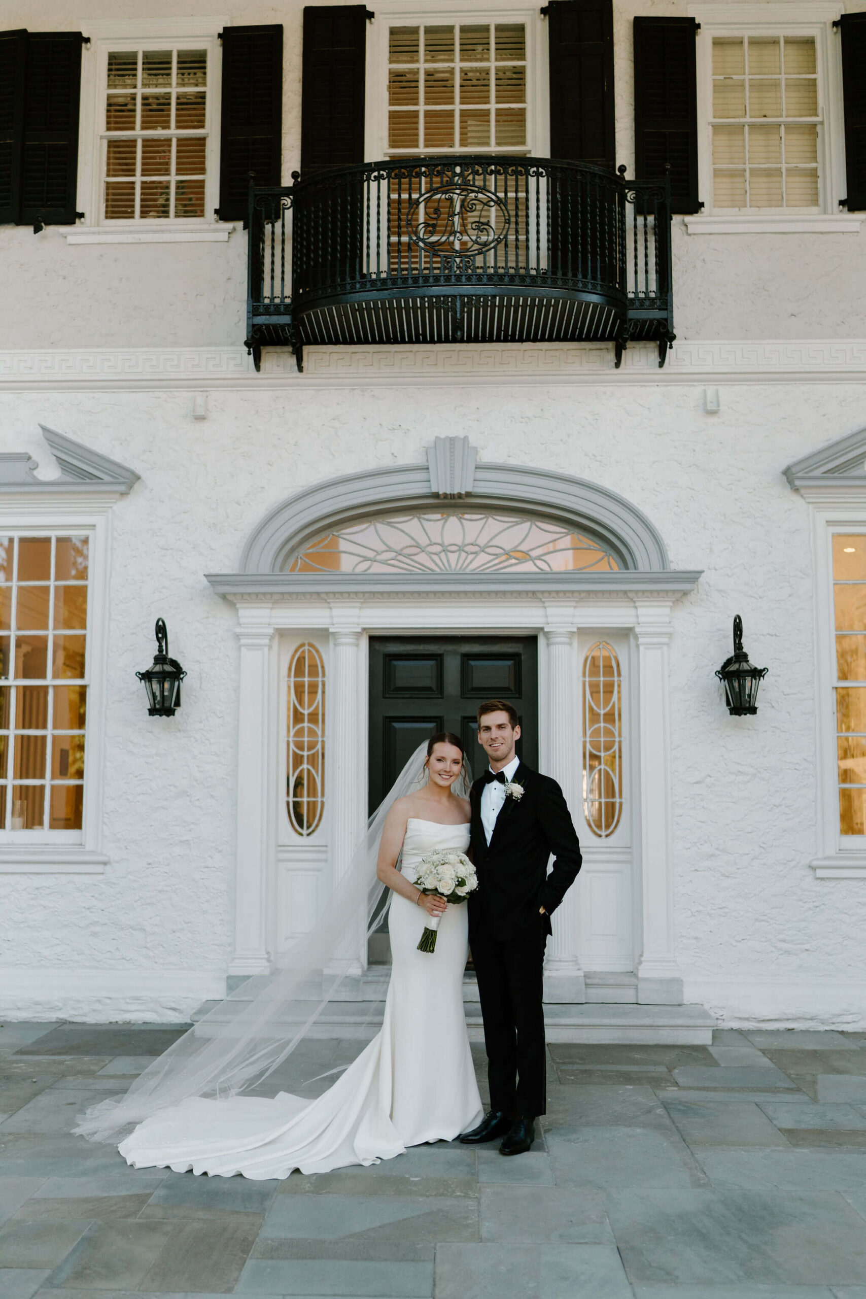 bride and groom on their wedding day at Radnor Valley Country Club in Philadelphia, PA, smiling at the camera