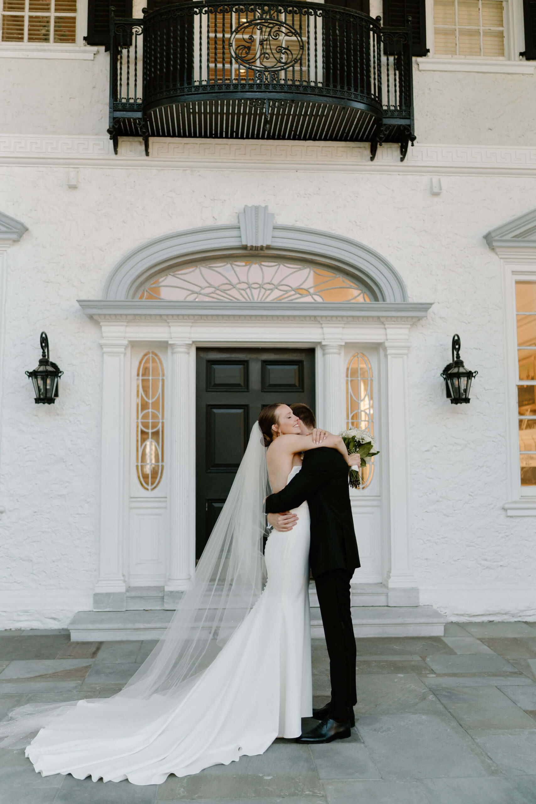 bride and groom embracing on their wedding day at Radnor Valley Country Club in Philadelphia, PA