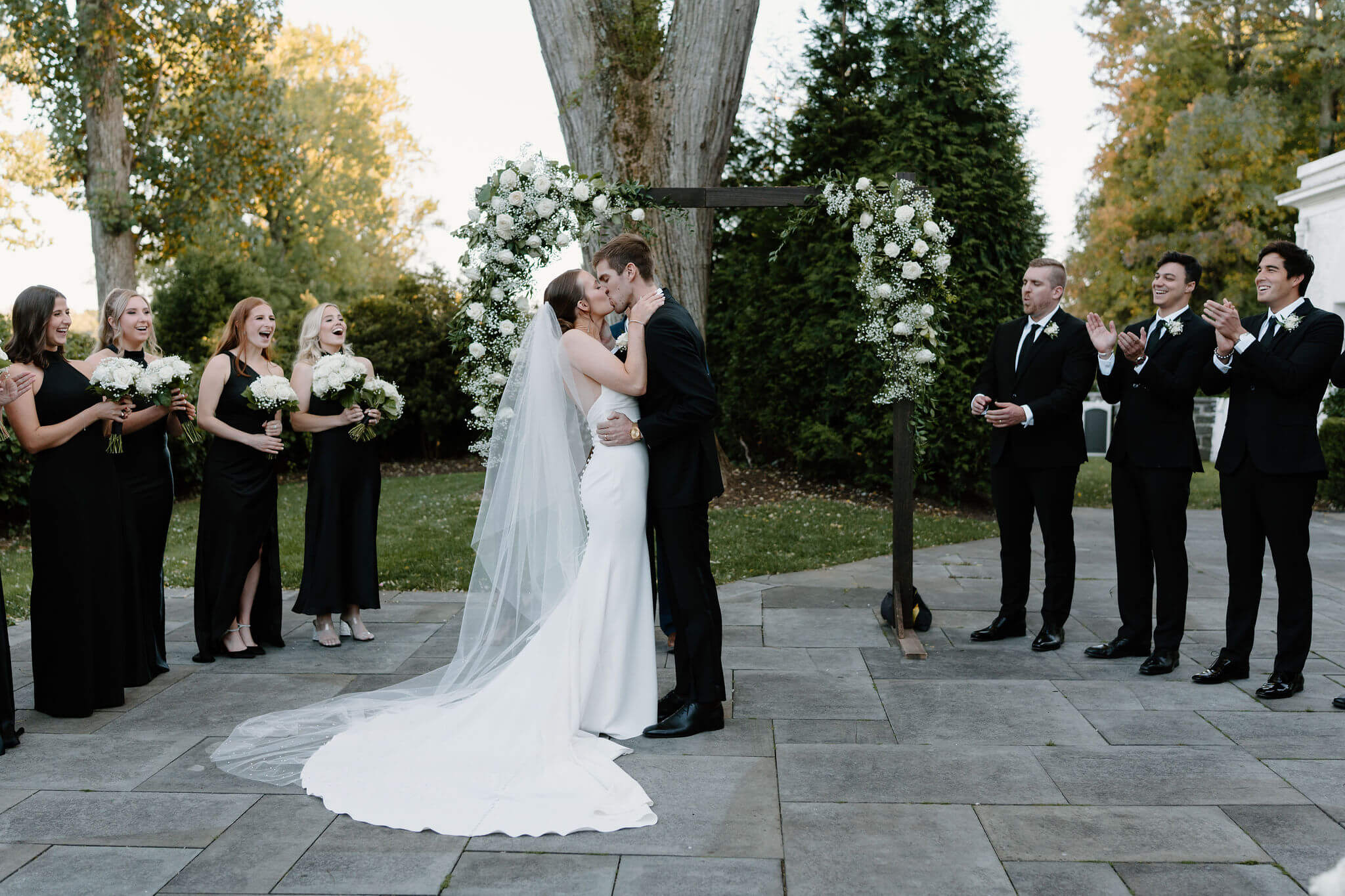 bride and groom's first kiss during their wedding ceremony