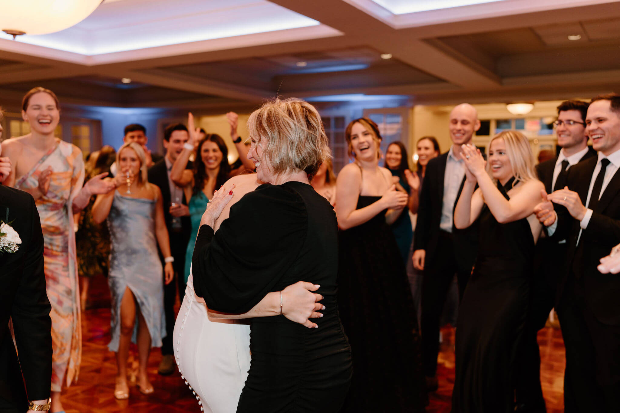 mother of the bride dancing with the bride on the dance floor at her wedding reception