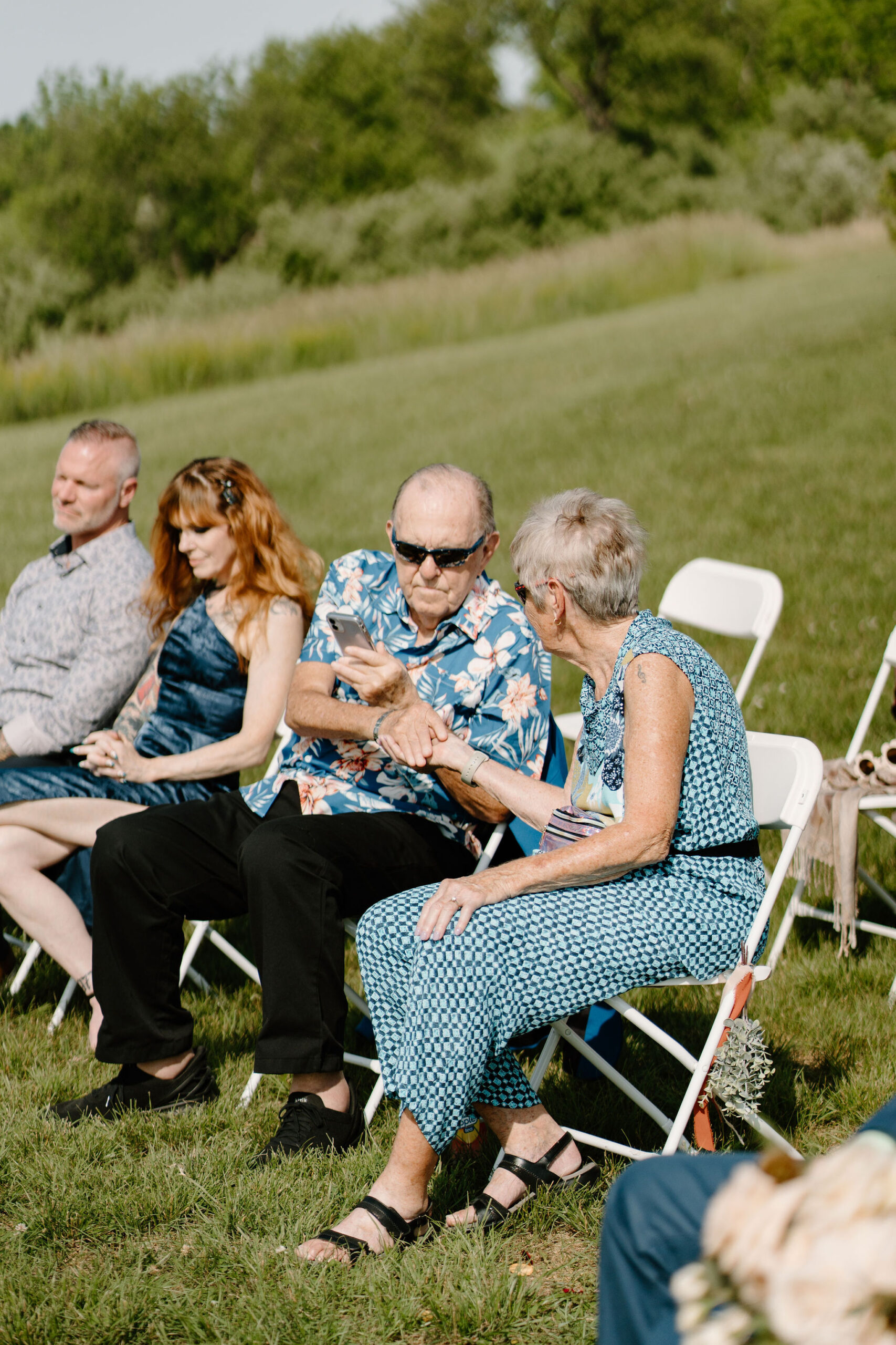grandparents of the bride passing rings around to each guest in a "ring warming ceremony"