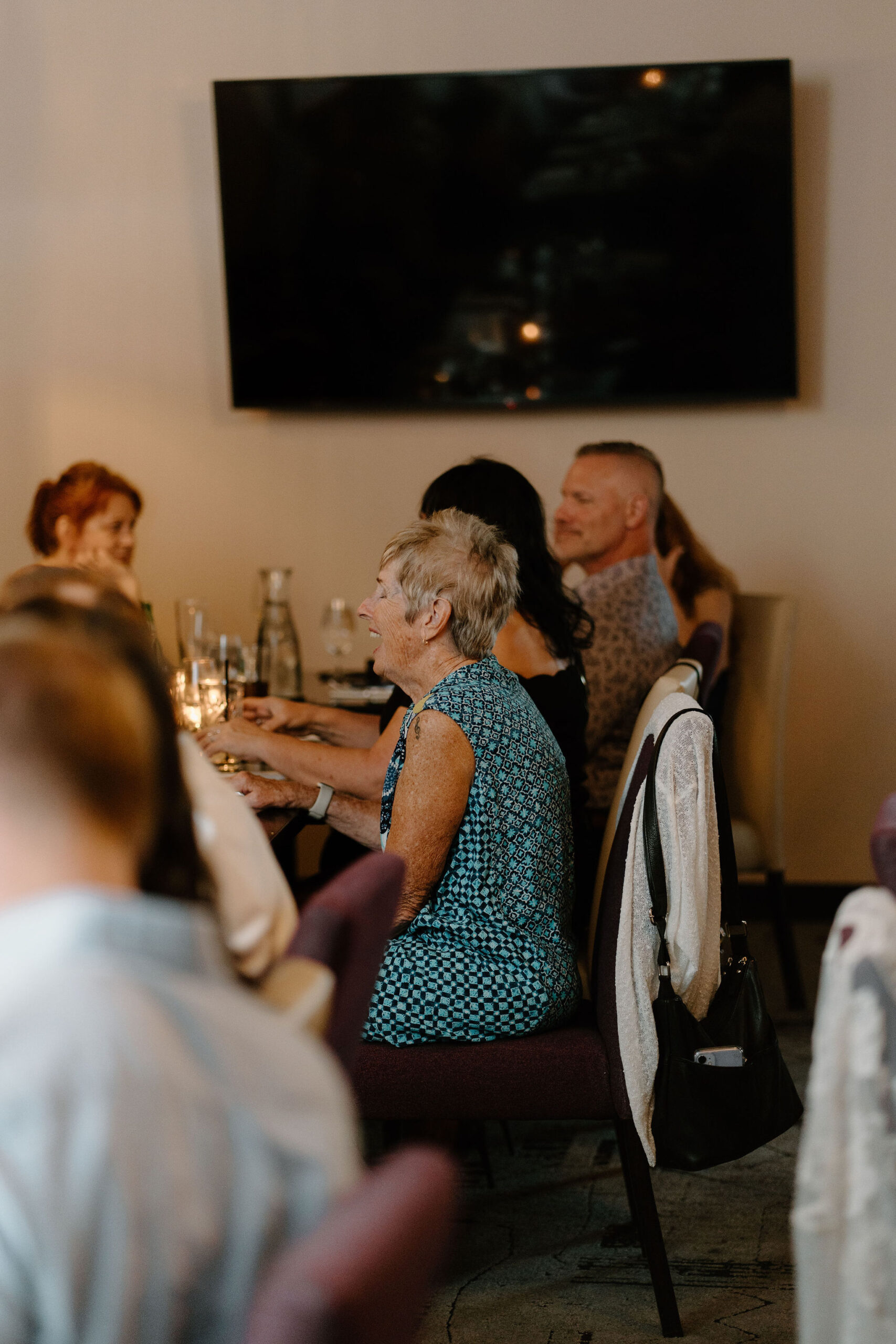 a guest laughing and smiling during cocktail hour