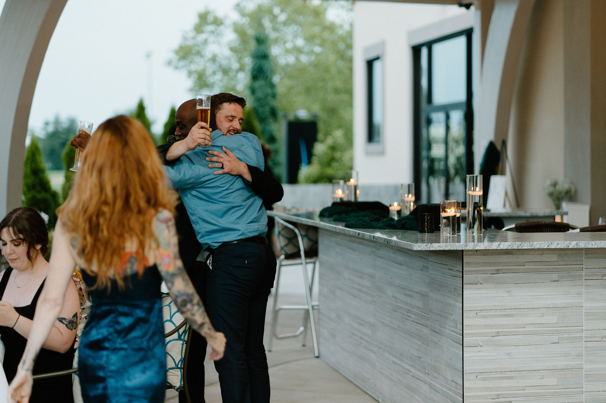 groom hugging his best man after his speech
