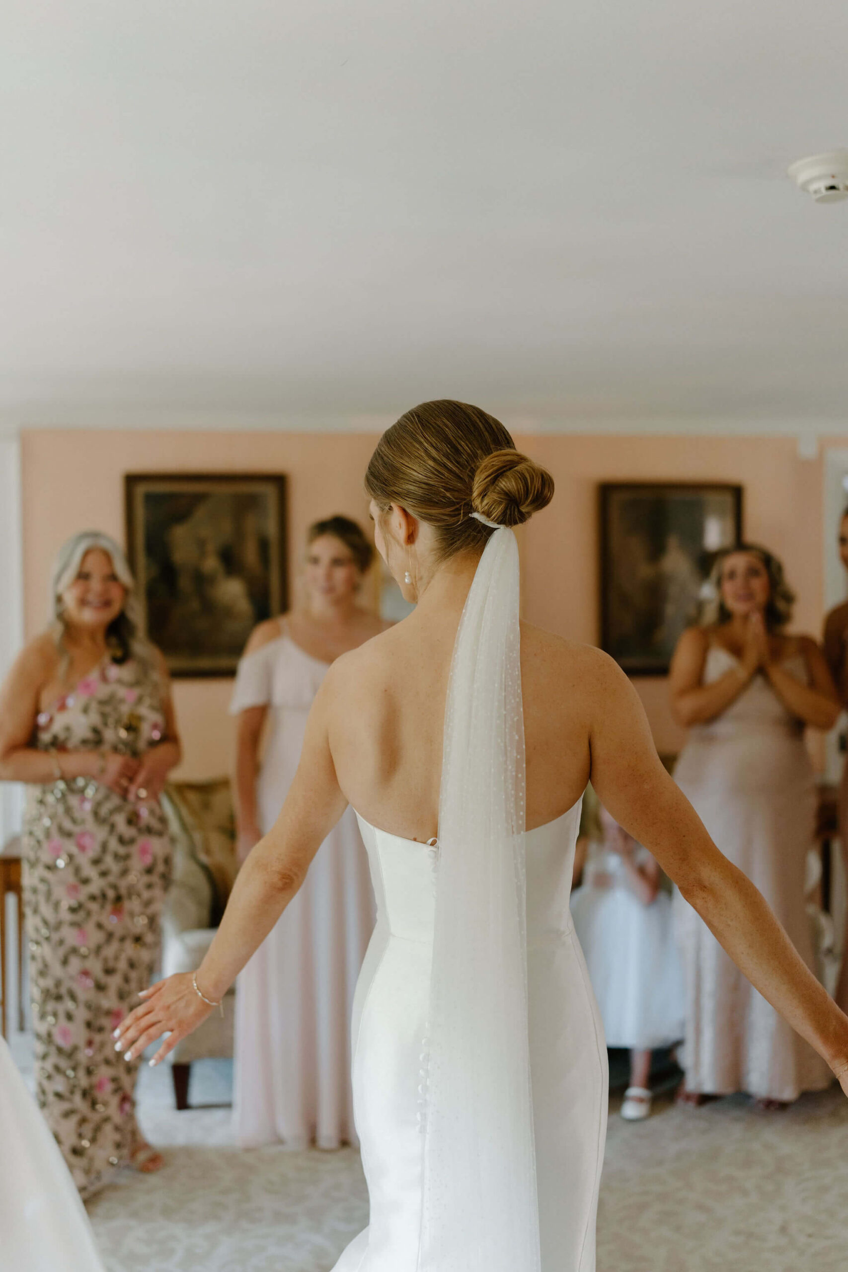 bride having a first look with her bridesmaids