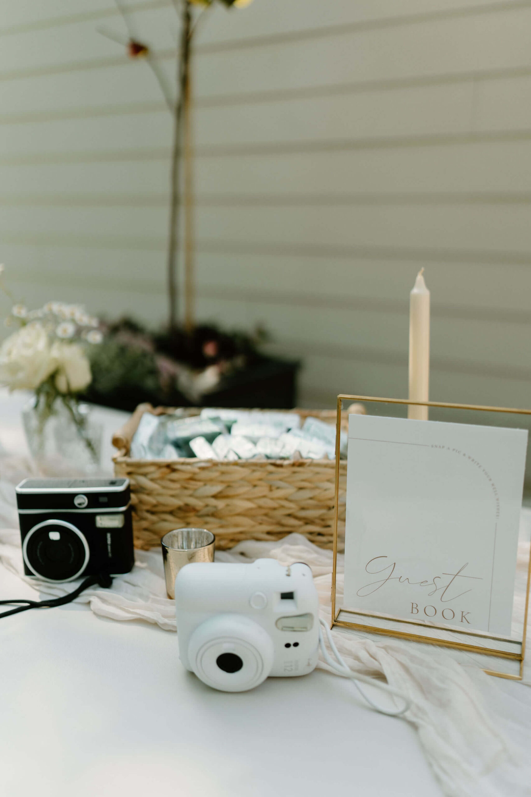 welcome table for a guest book, with polaroid cameras