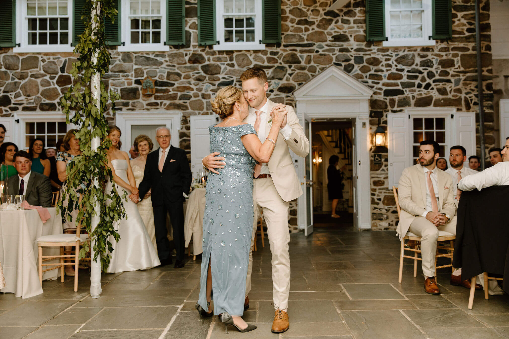 groom having first dance with his mother during wedding reception