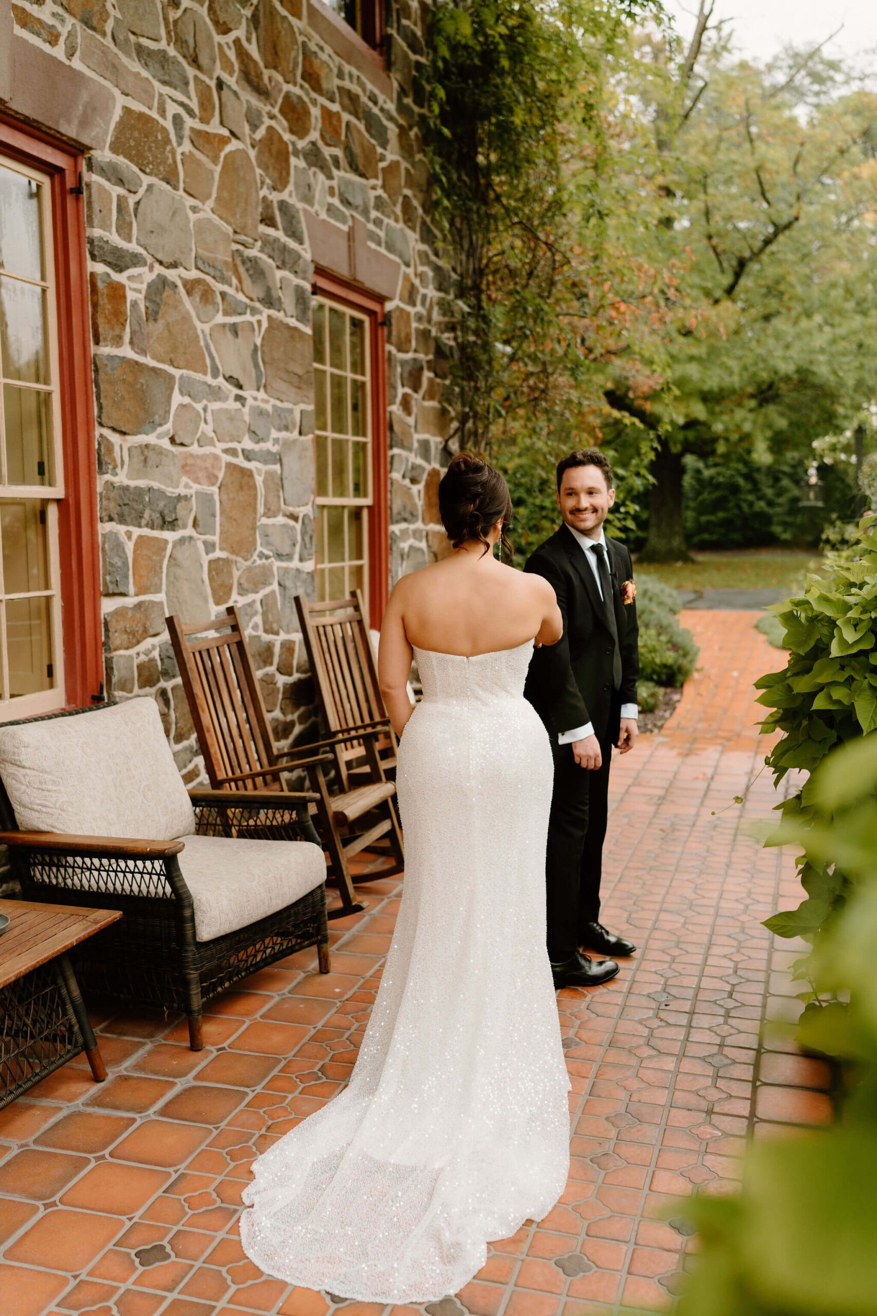 groom seeing bride for the first time on their wedding day, smiling widely