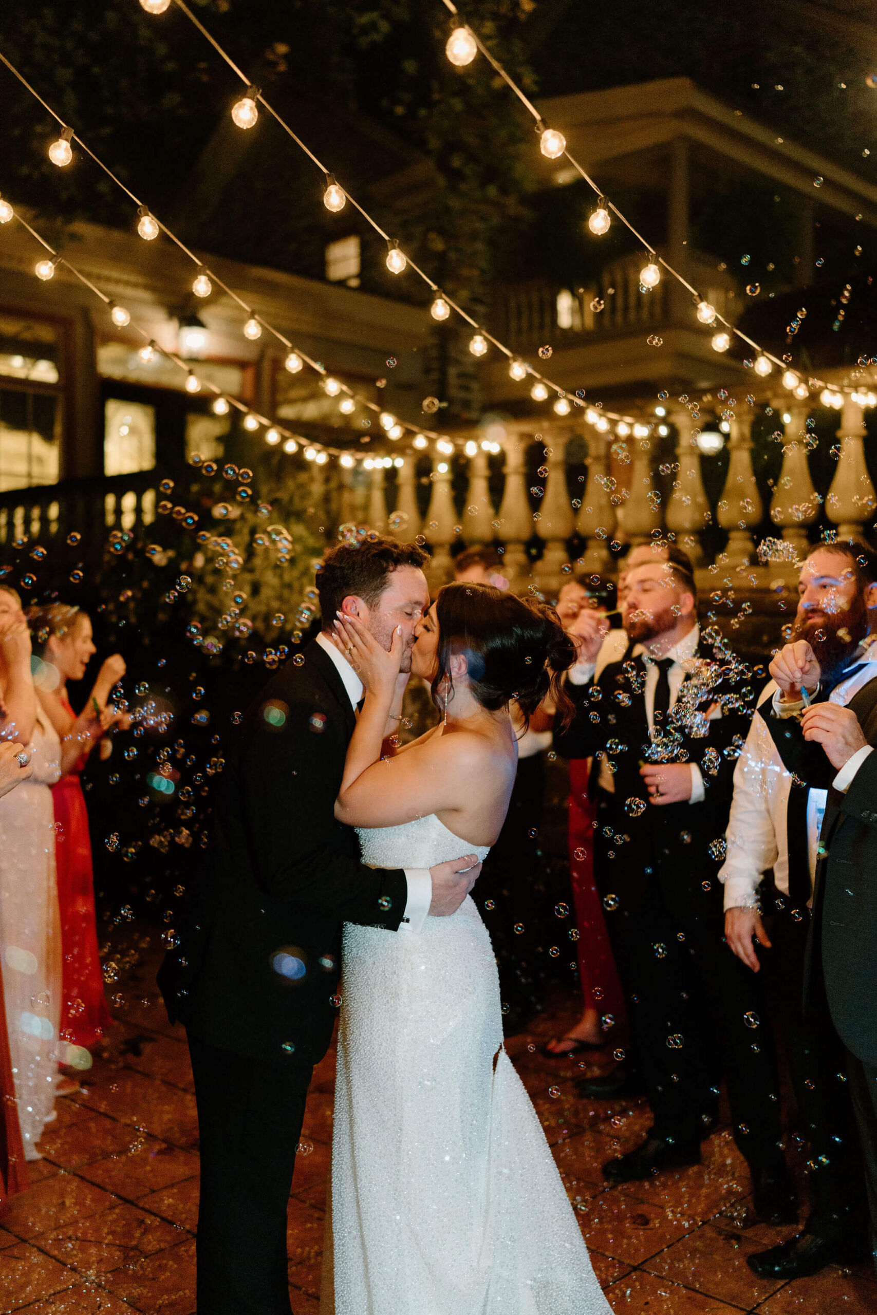 bride and groom having a bubble send off at the end of their fall wedding reception 