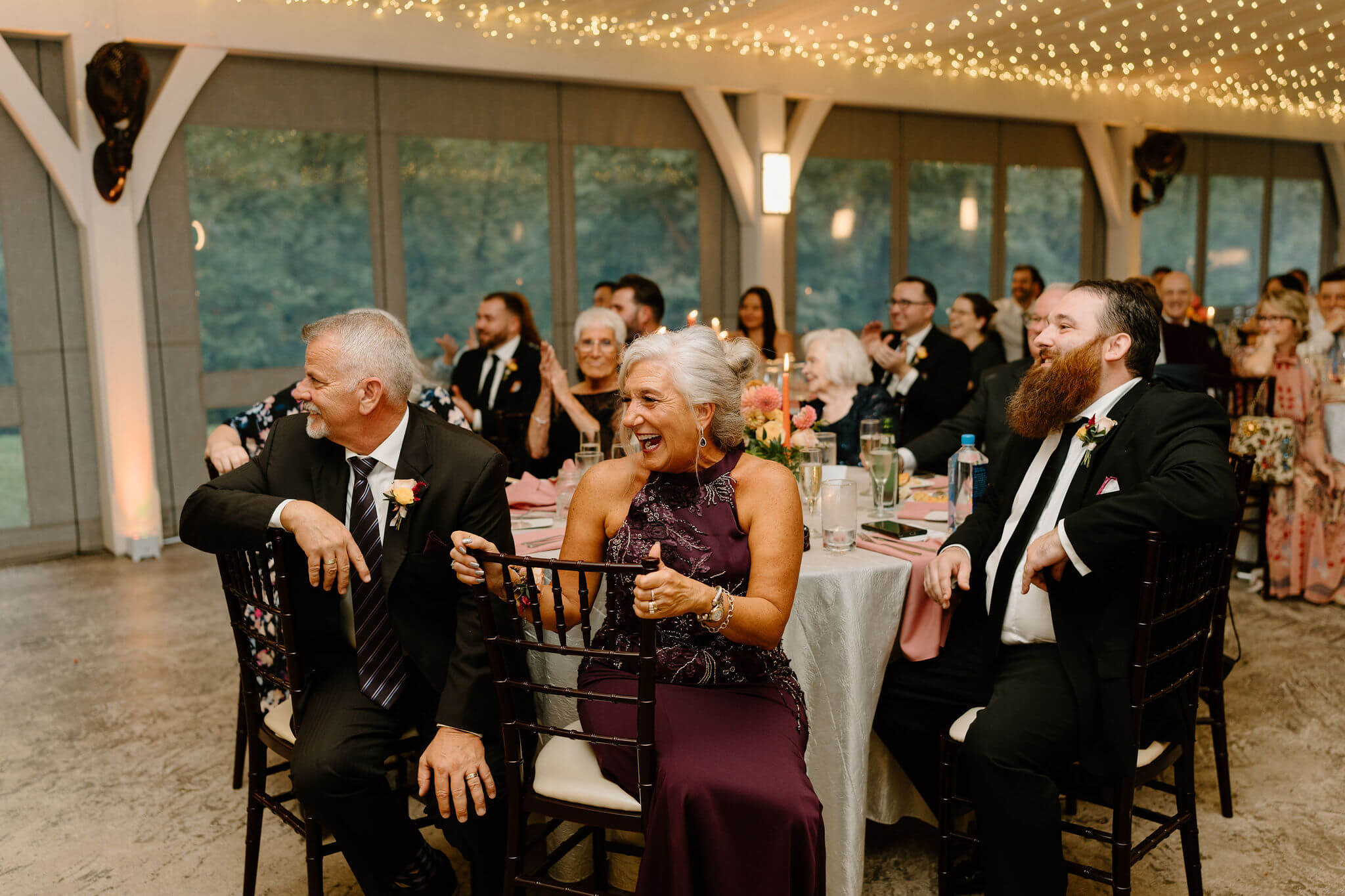mother of the groom laughing during speeches
