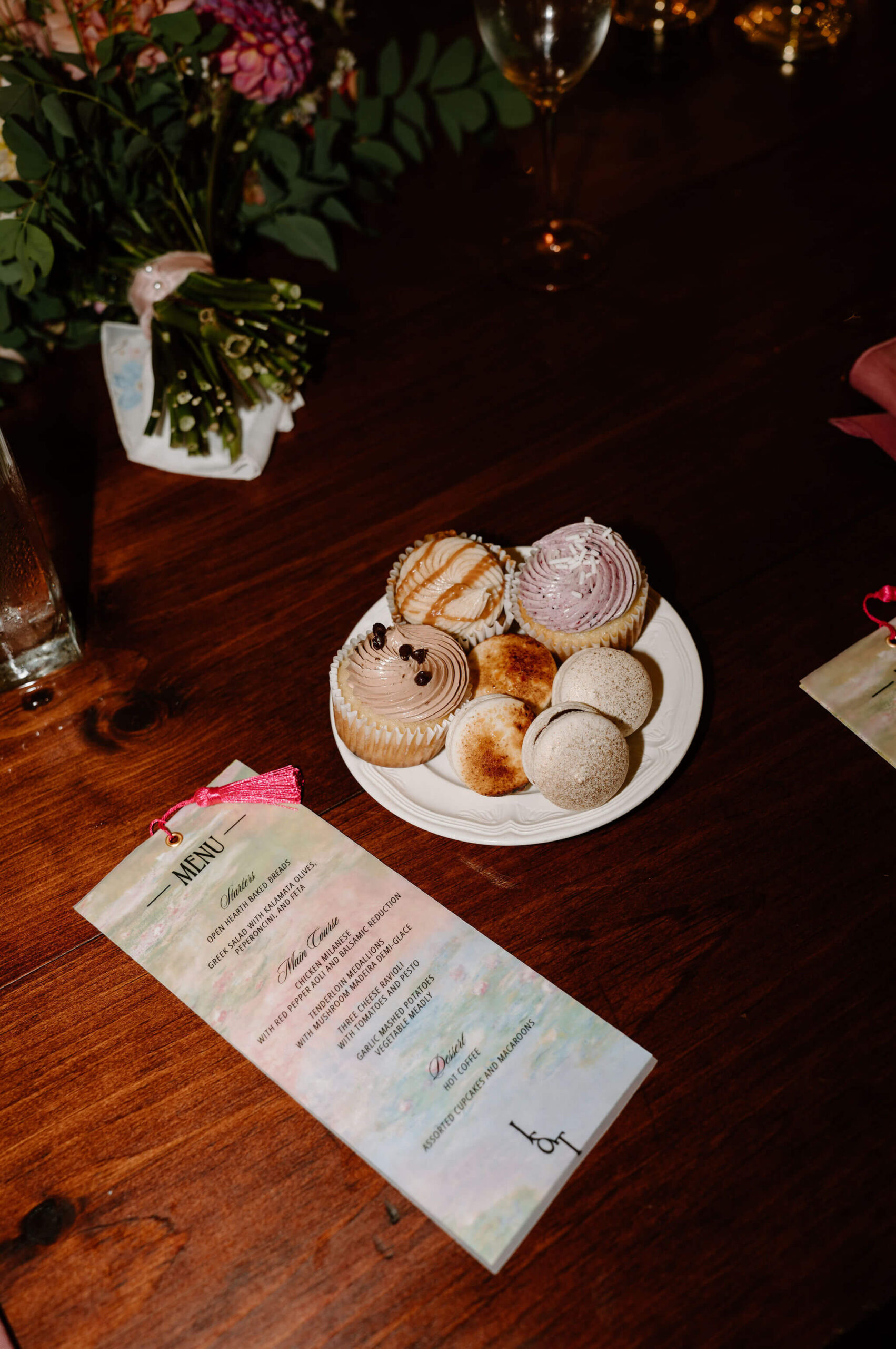 plate of beautiful wedding desserts with printed menu of dinner selection