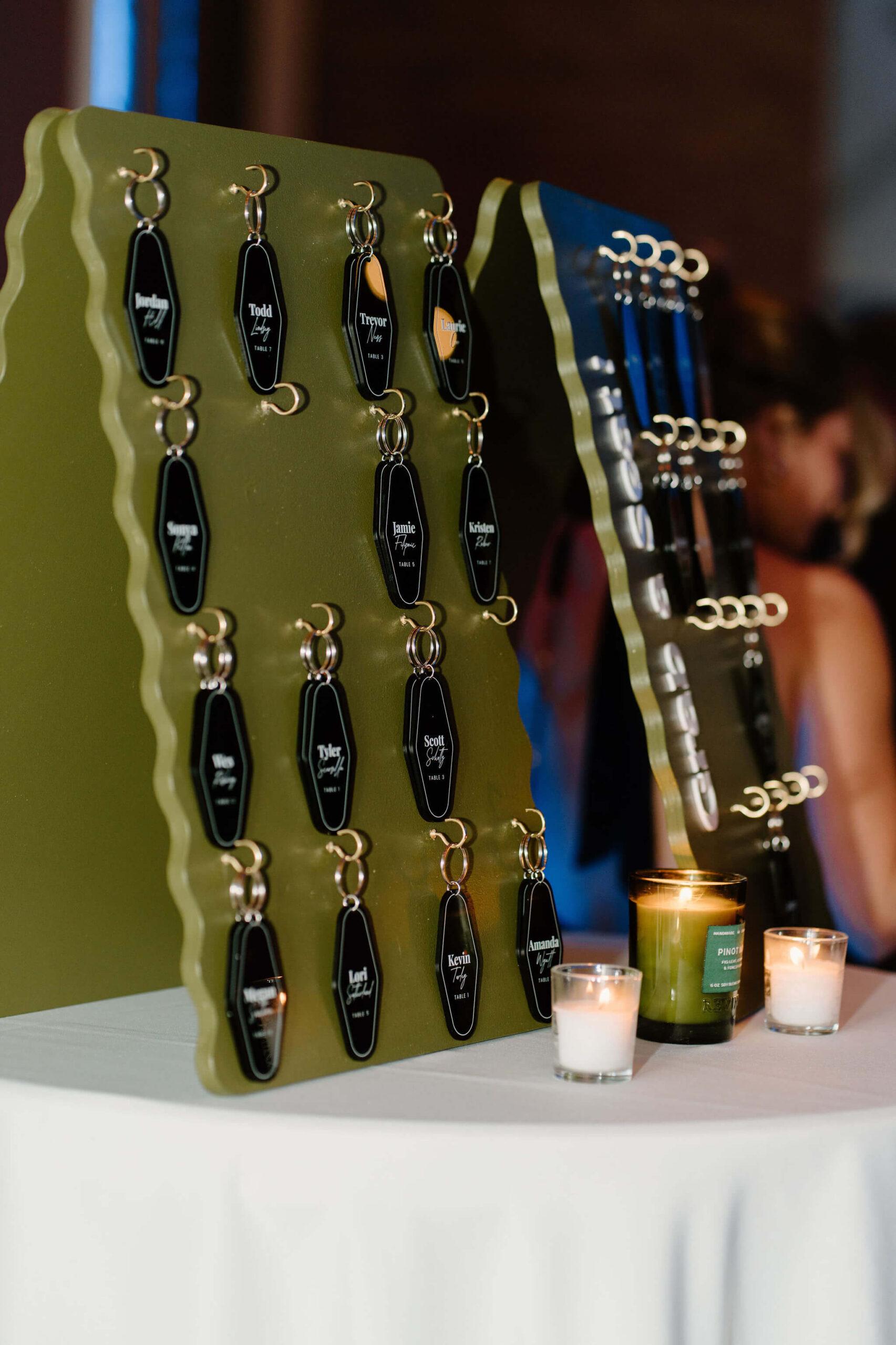 seating chart for wedding reception of custom luggage tags with every guest's names written on them