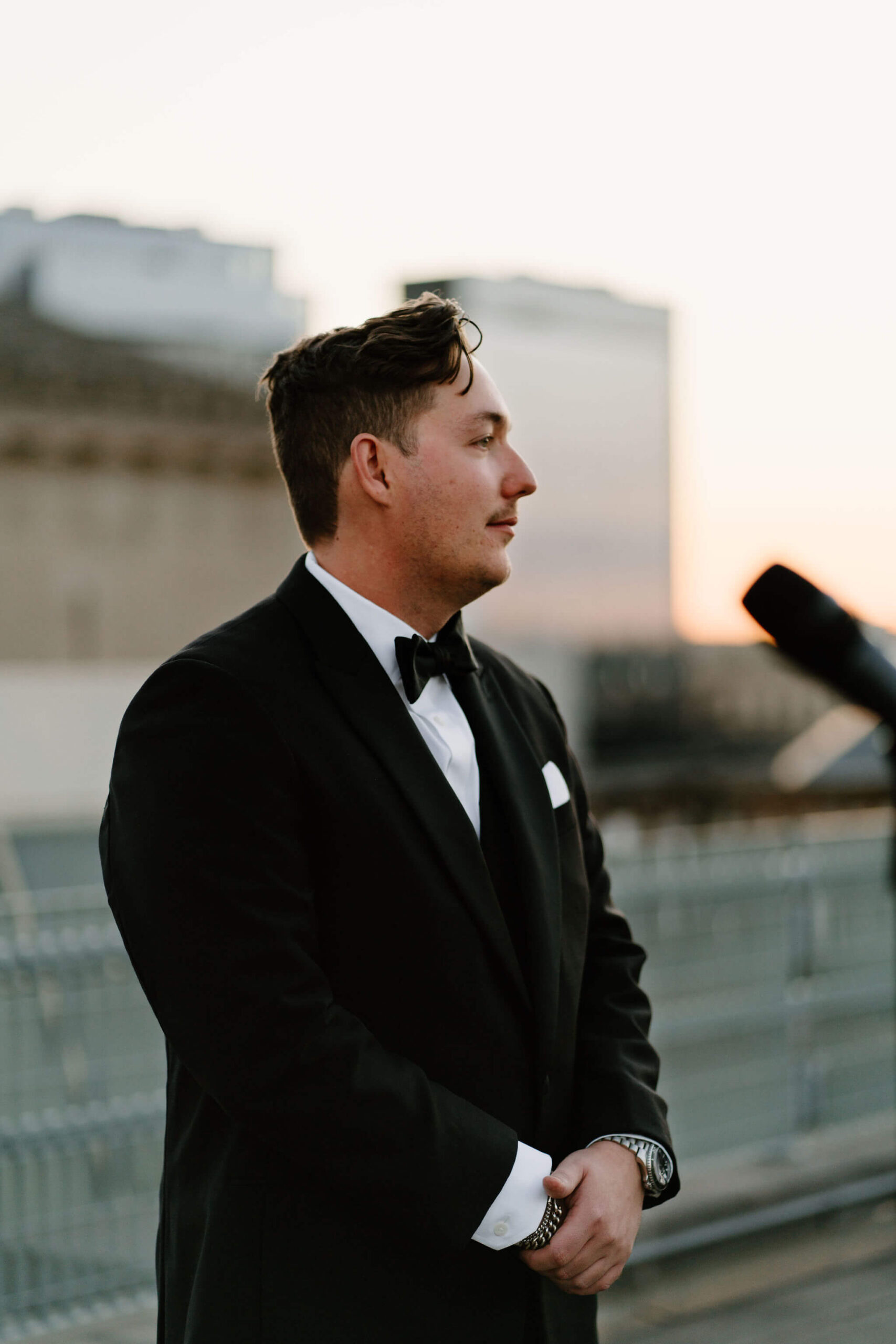 groom looking expectantly up the aisle for his bride