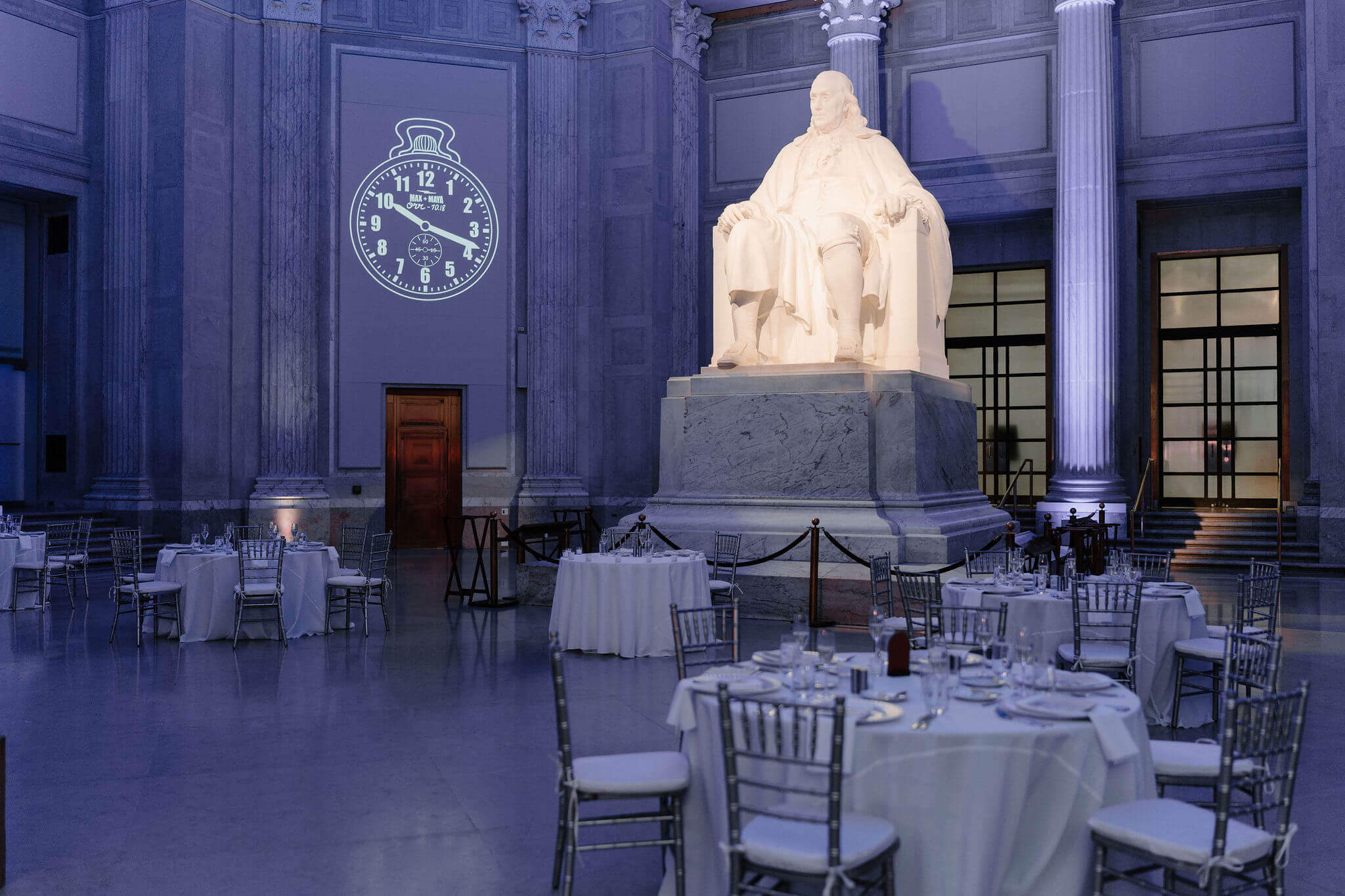 a large statue of Benjamin Franklin in the center of a Franklin Institute Wedding Reception