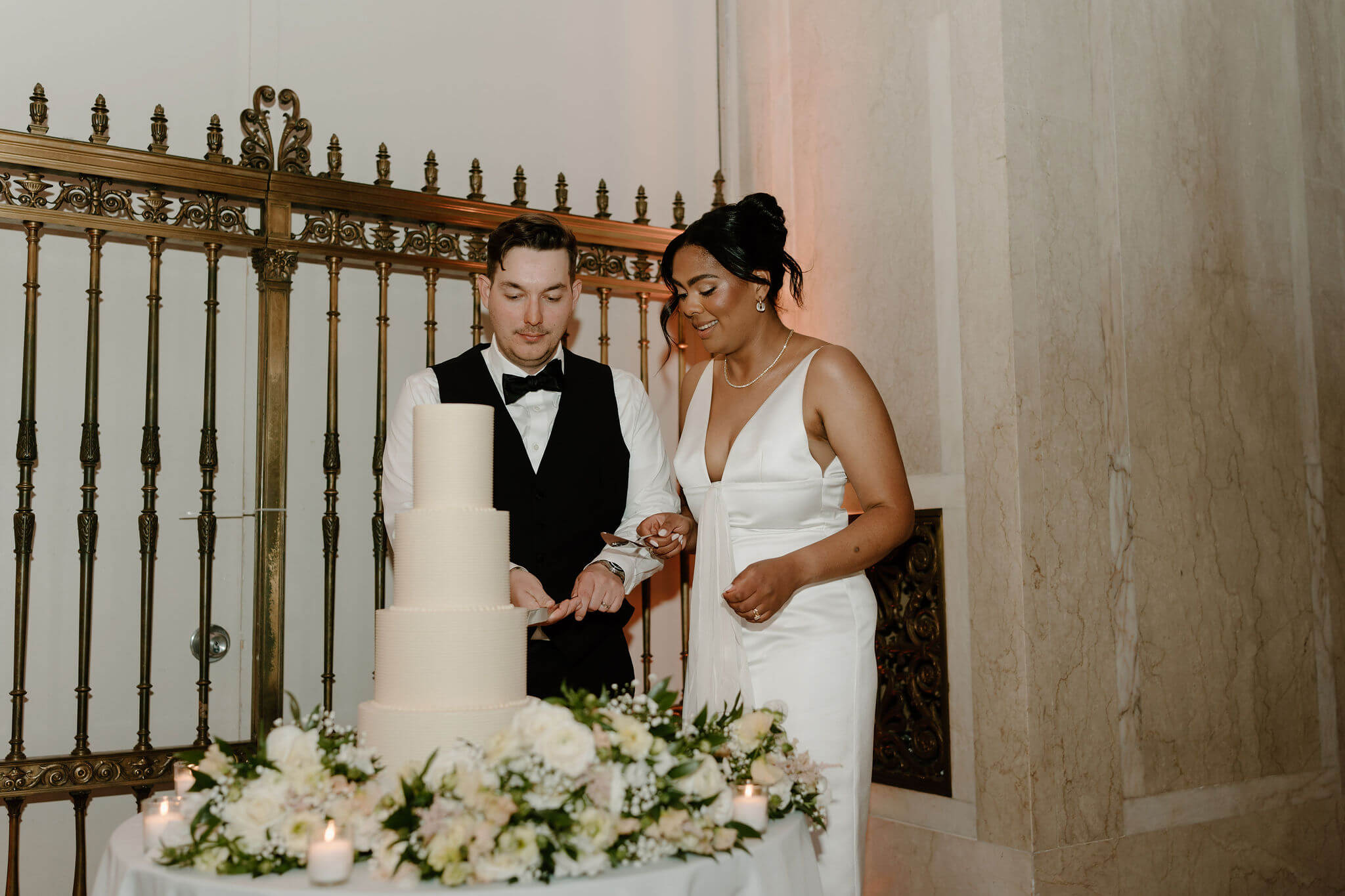 bride and groom cutting their wedding cake