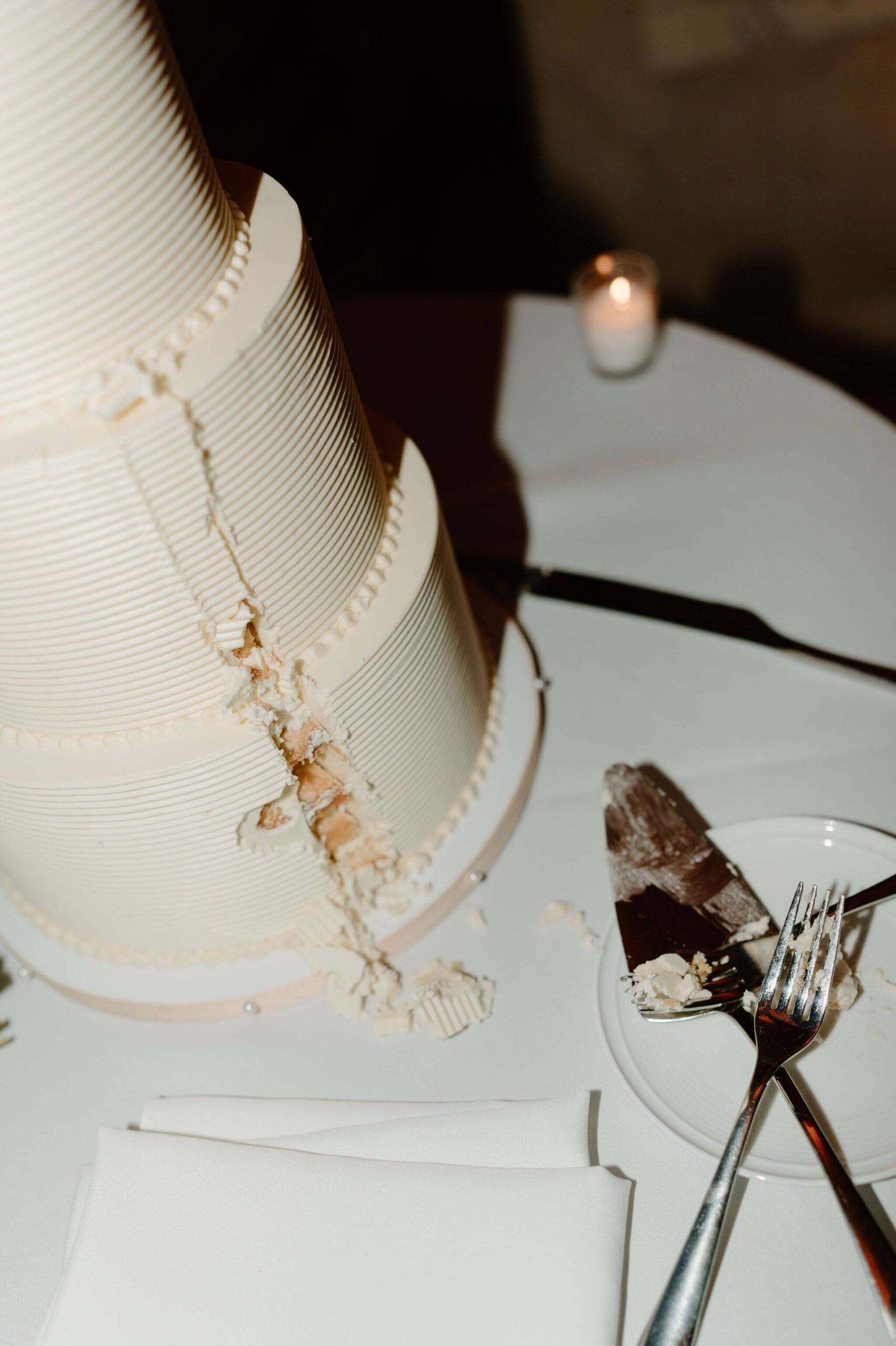 a close-up of the slice that the bride and groom took out of their two-tiered wedding cake