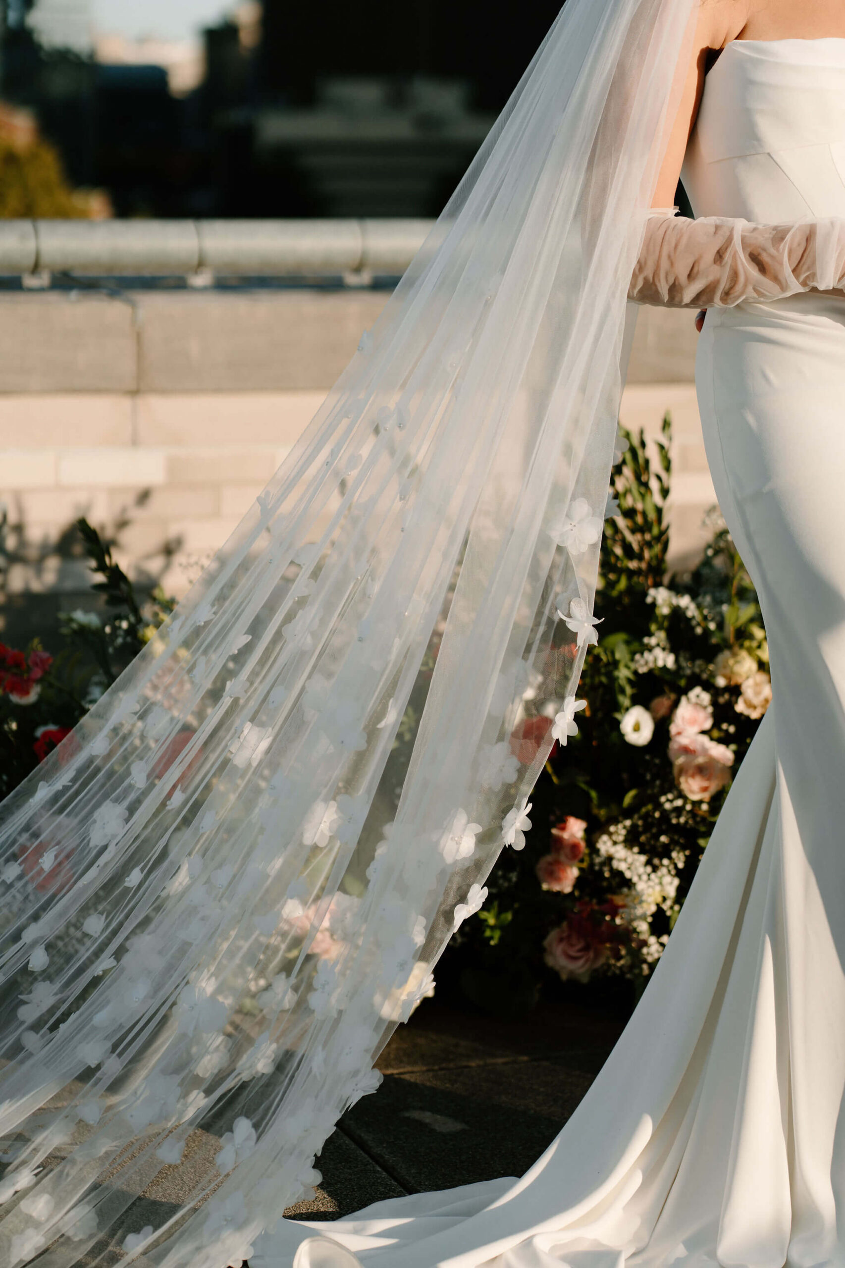 close up of bride's veil, with floral textures attached