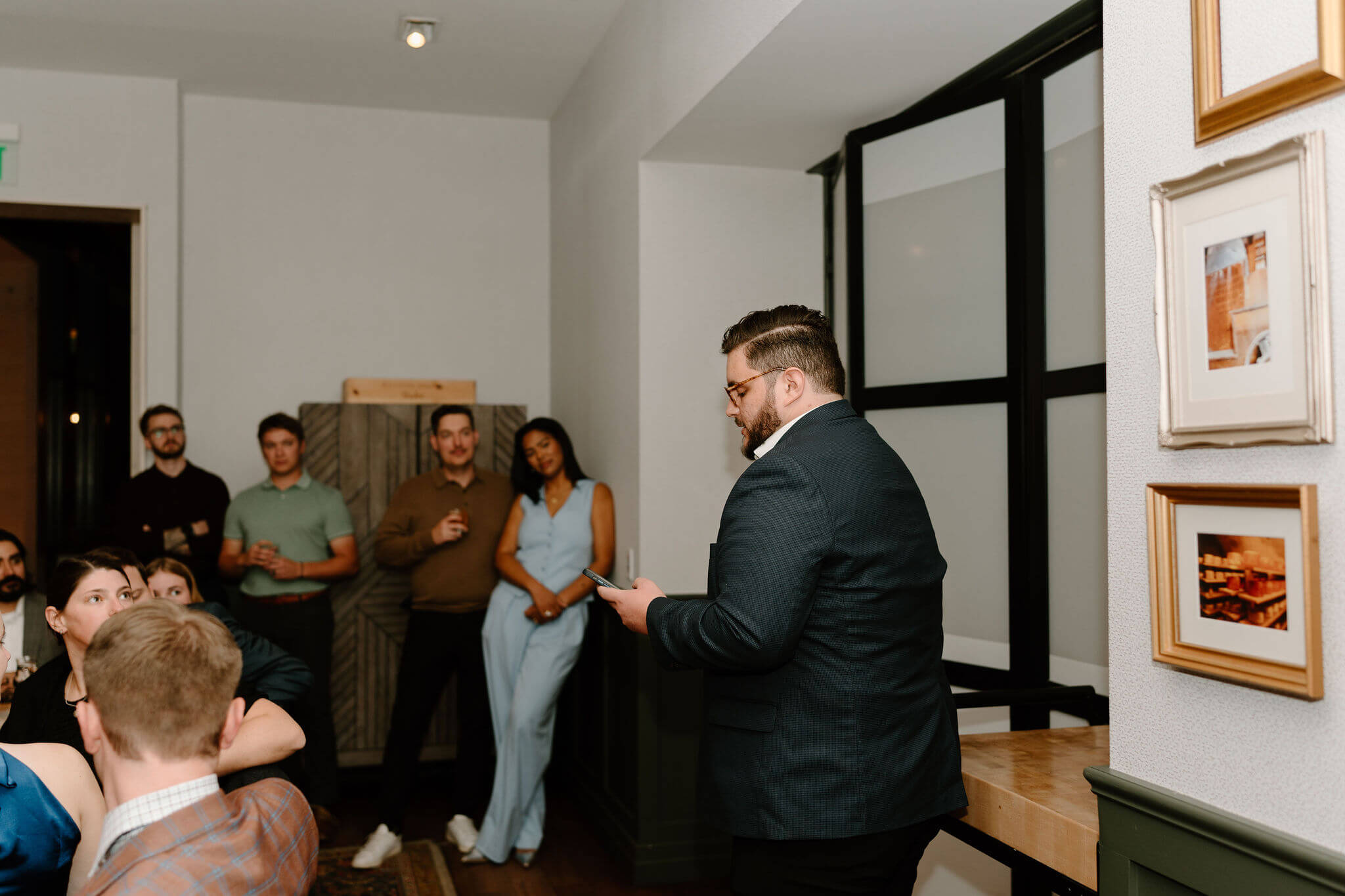 groomsman giving a speech for the bride and groom at their rehearsal dinner