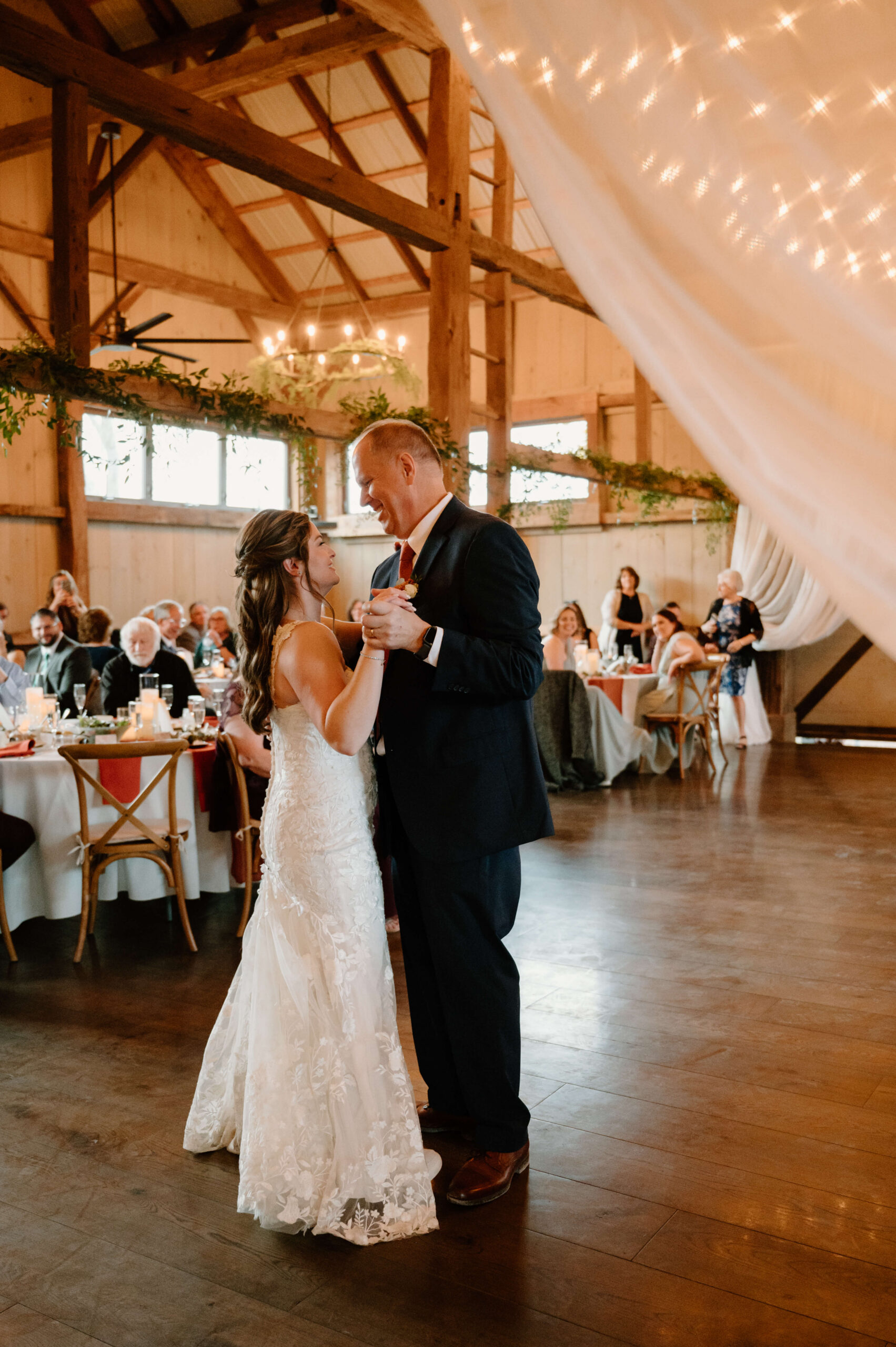 bride dancing with her father during her wedding reception at the Farm Bakery and Events