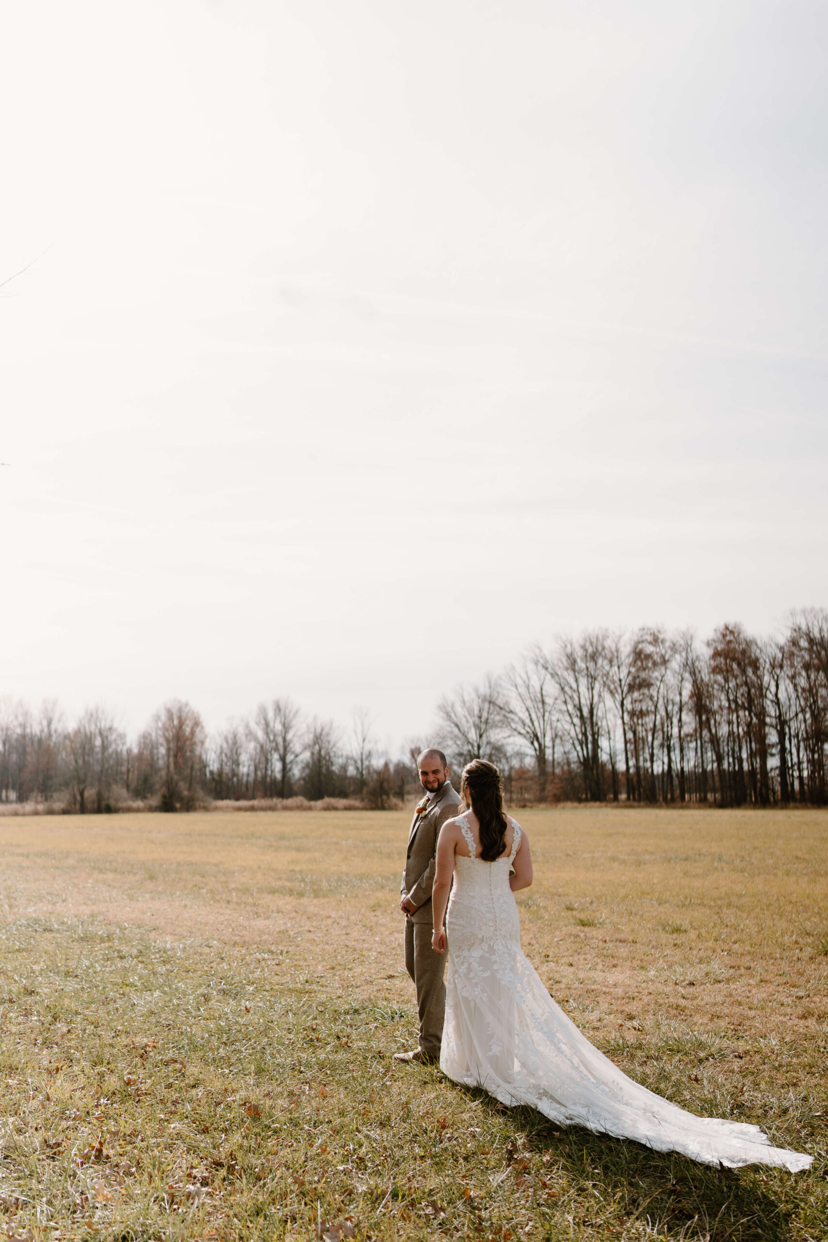 groom turning around to see his bride during their first look on their wedding day