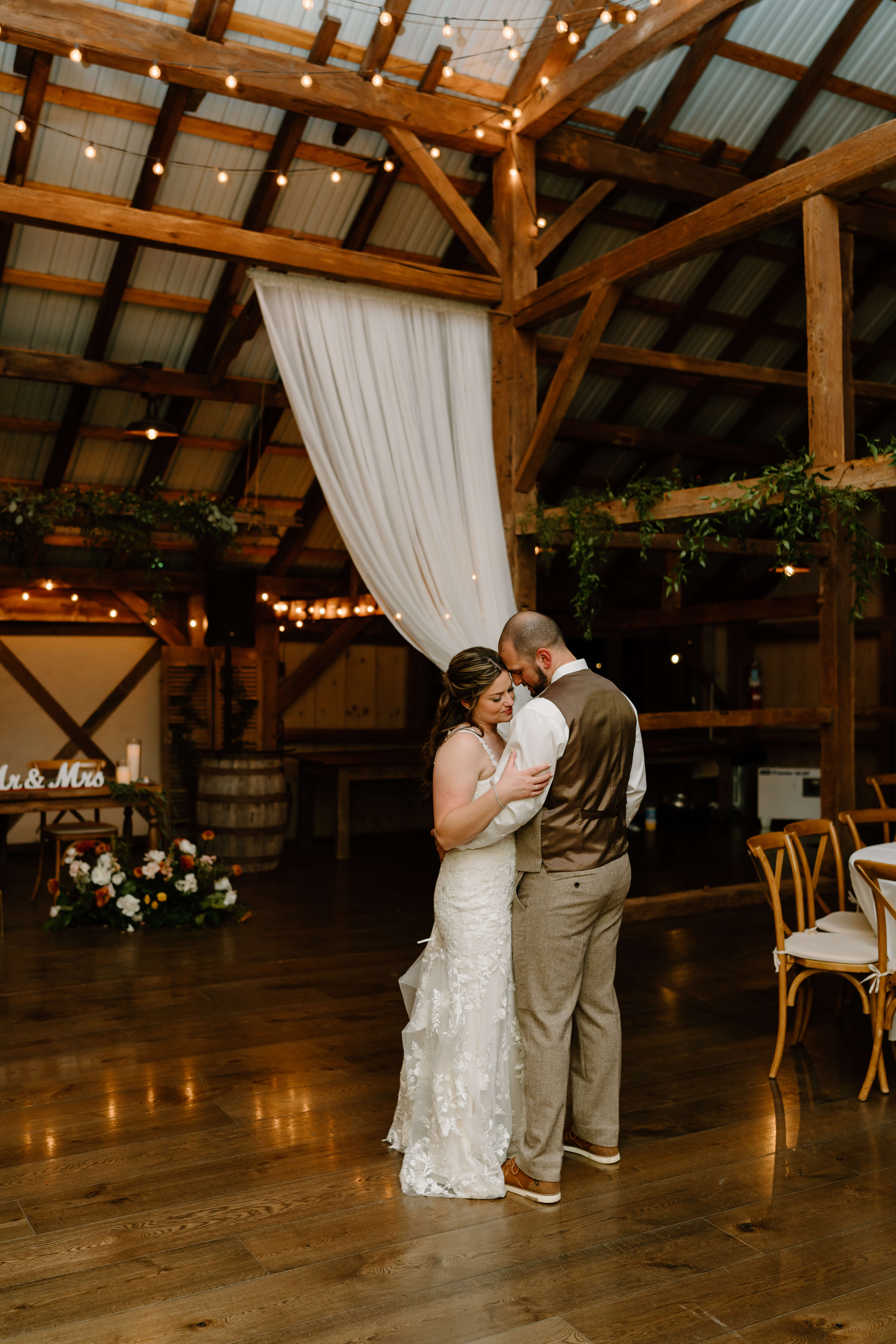 bride and groom sharing a private last slow-dance after their reception on their November wedding day at the Farm Bakery and Events